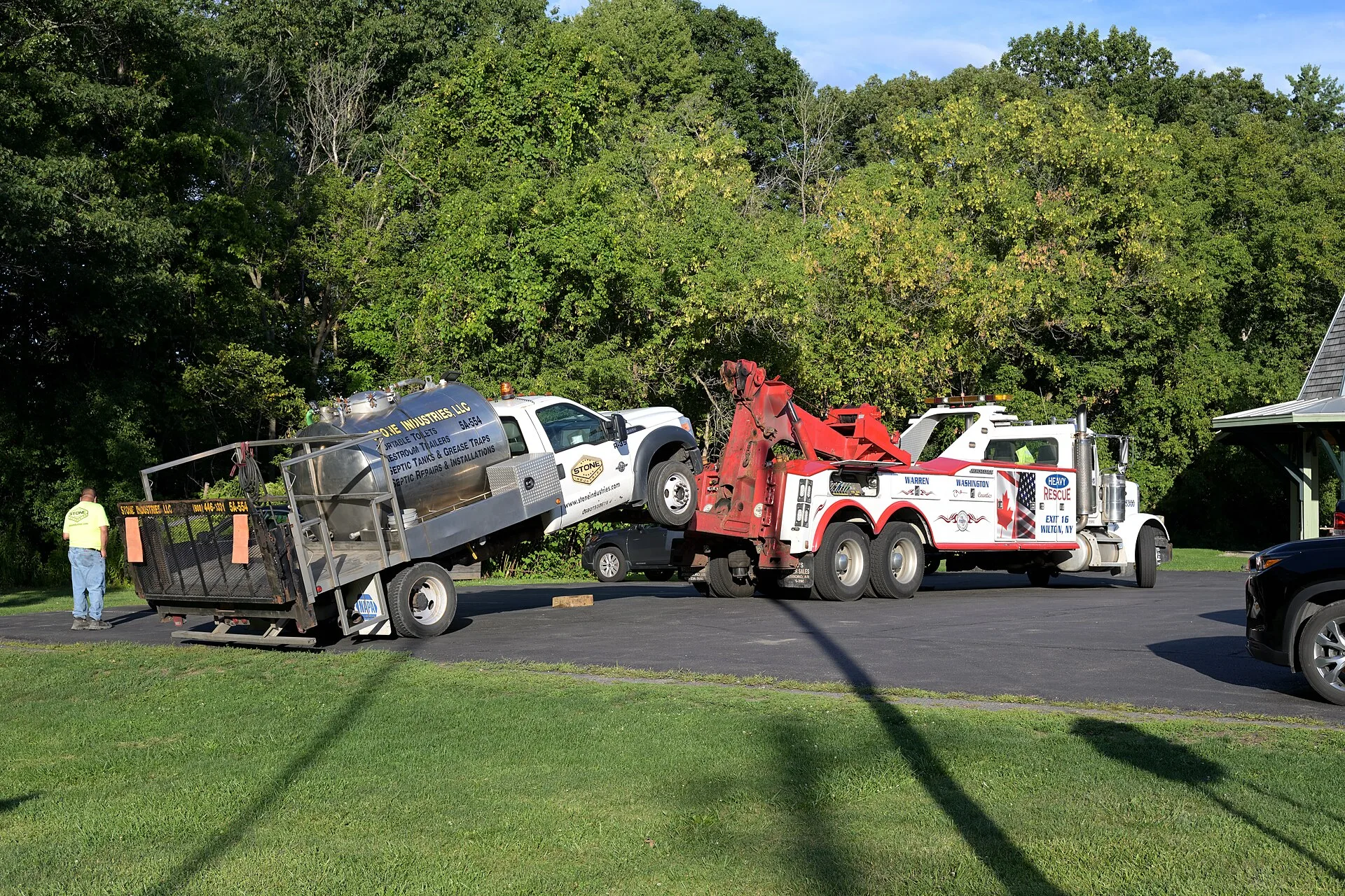 A broken-down portable toilet service truck gets towed in Voorheesville, NY. How to price portable restroom rental jobs from the drive, not the unit