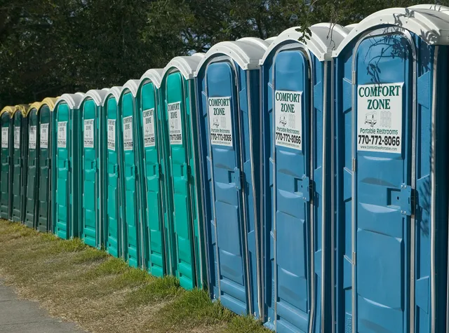 [Hurricane Katrina] Algiers, LA., 10/29/2005 -- A line of portable toilets at a Base Camp. Base camps were set up in various locations around New orleans for rescue workers and volunteers needing housing following Hurricane Katrina. Andrea Booher/FEMA. OSHA sanitation rules for construction sites: how many portable restrooms per worker