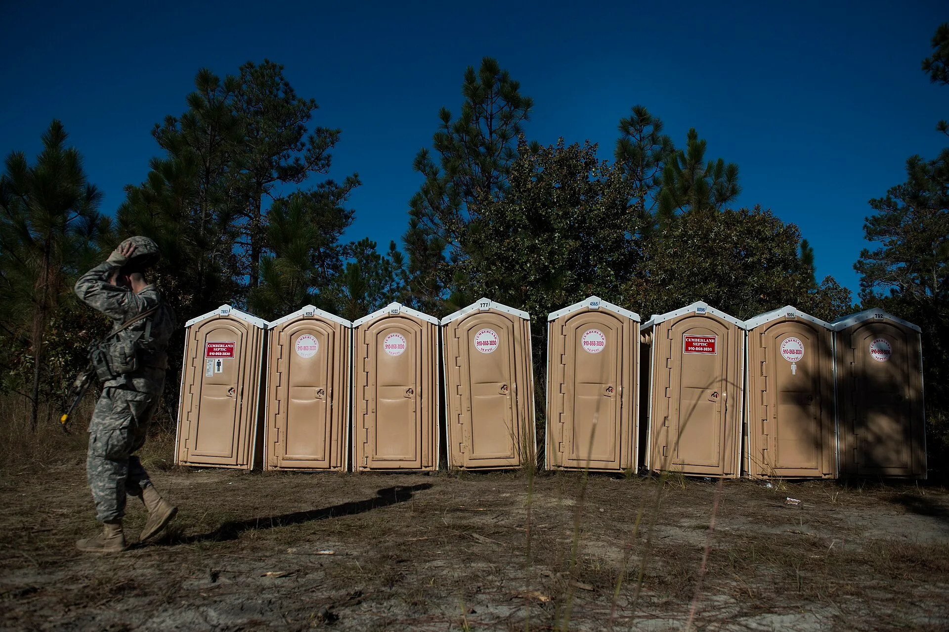 A U.S. soldier with the 82nd Airborne Division leaves the portable toilet area during a field training exercise at Fort Bragg, N.C., Oct. 26, 2013. The five-day exercise integrated efforts between the 82nd Airborne Division and its Air Force partners. (U.S. Air Force photo by Senior Airman James Ric. Equipment classes in portable restroom rental, paired to real demands