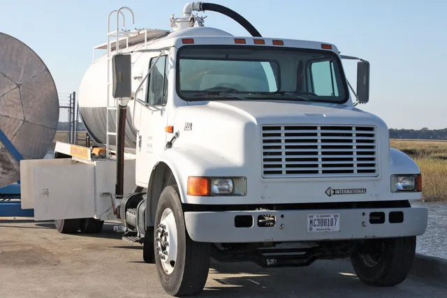 A back truck, used to vacuum oil and water after a spill sits at the ready during the spill training exercise at the Air Station fuel pier Nov. 2. Through oil extraction efforts, facility response teams are able to extract about 20 to 30 percent of oil spilled. Portable restroom rental maintenance: two machines, two different regimes